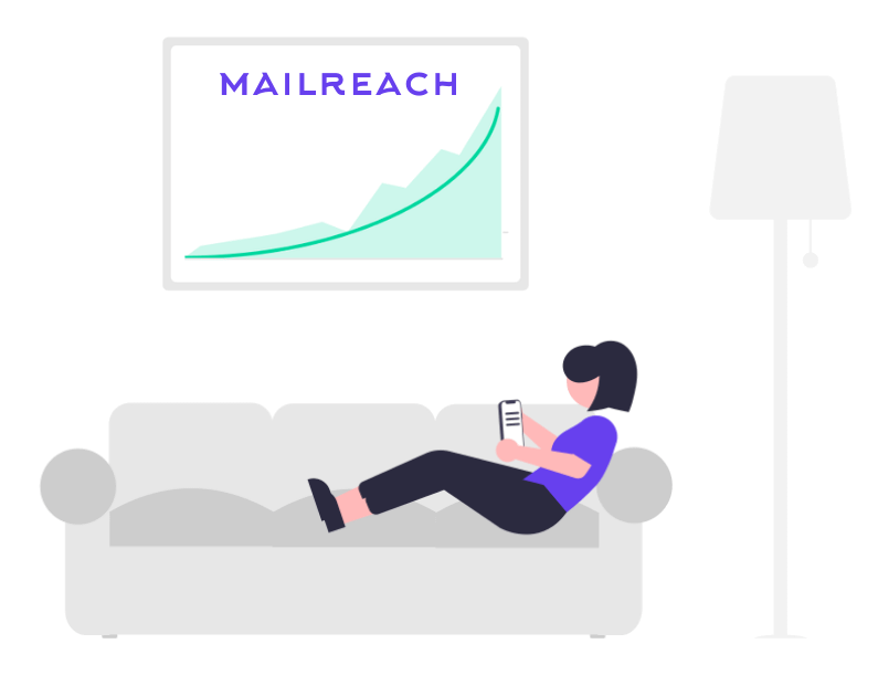 a girl sitting on a sofa uses Mailreach email warm up service